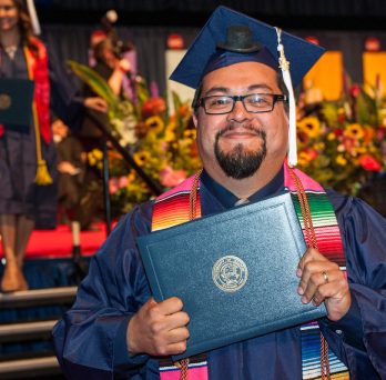Hispanic man graduates 