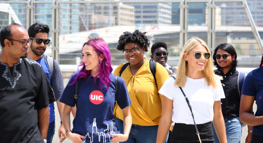 Student group walking in front of expressway