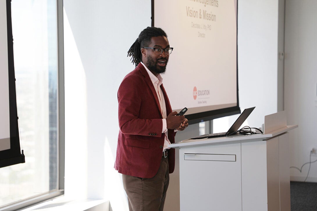 Decoteau Irby presenting in front of a slide show