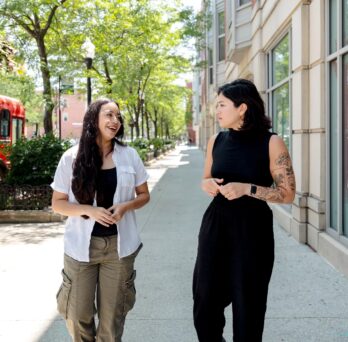 Briana Salas and Marina Alvarez walking down Halsted street. 