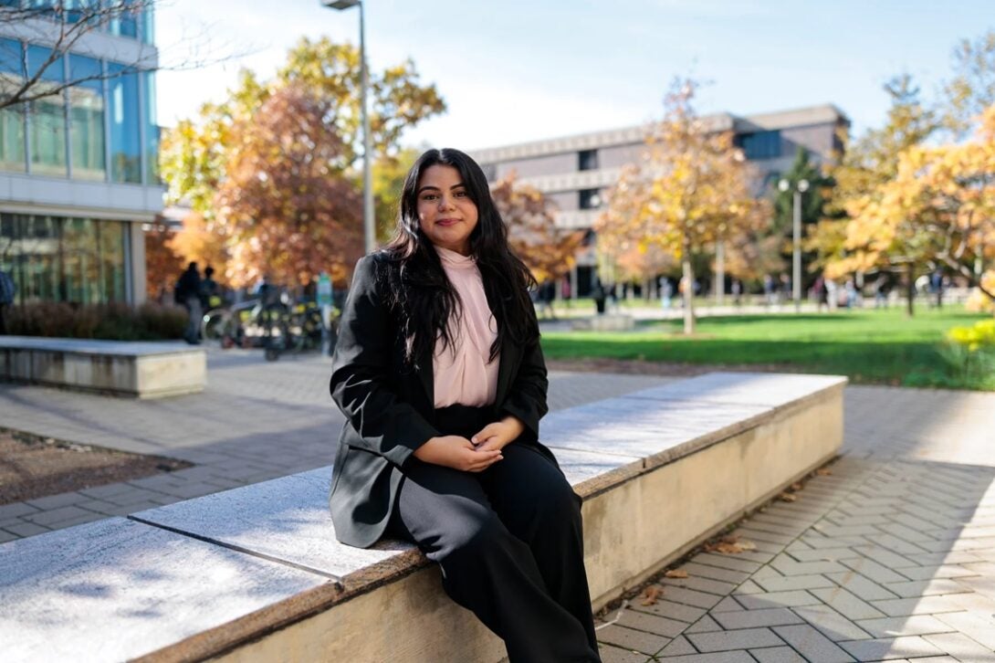 Monica Padilla sitting outside on UIC's East Campus